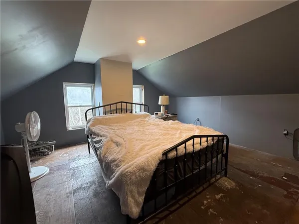 a bedroom with a bed and dresser