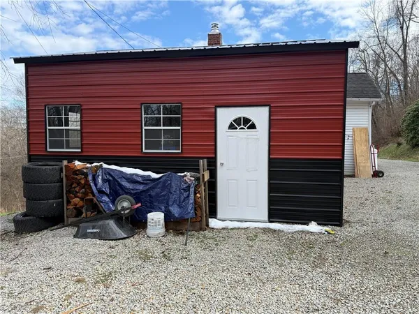 a front view of a house with furniture
