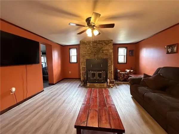 a living room with furniture and a flat screen tv