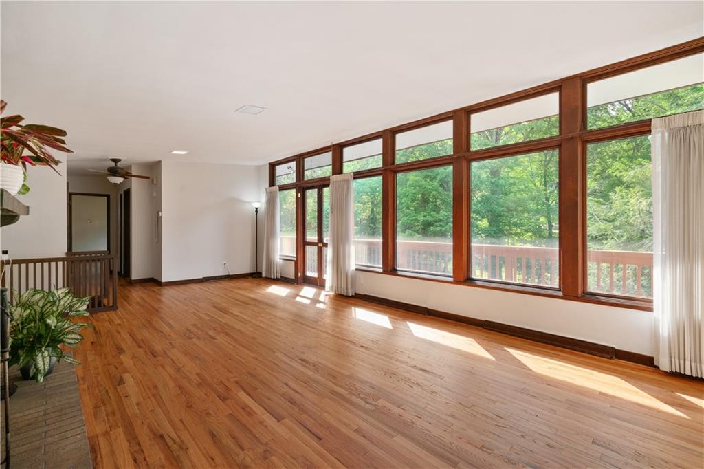 102 Colwyn Road Pittsburgh, PA 15237 - Photo 17 of 29 a view of an empty room with wooden floor and a window