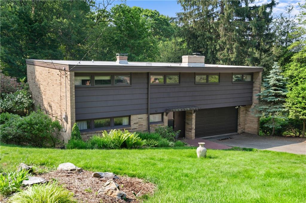 102 Colwyn Road Pittsburgh, PA 15237 - Photo 2 of 29 a front view of a house with a yard