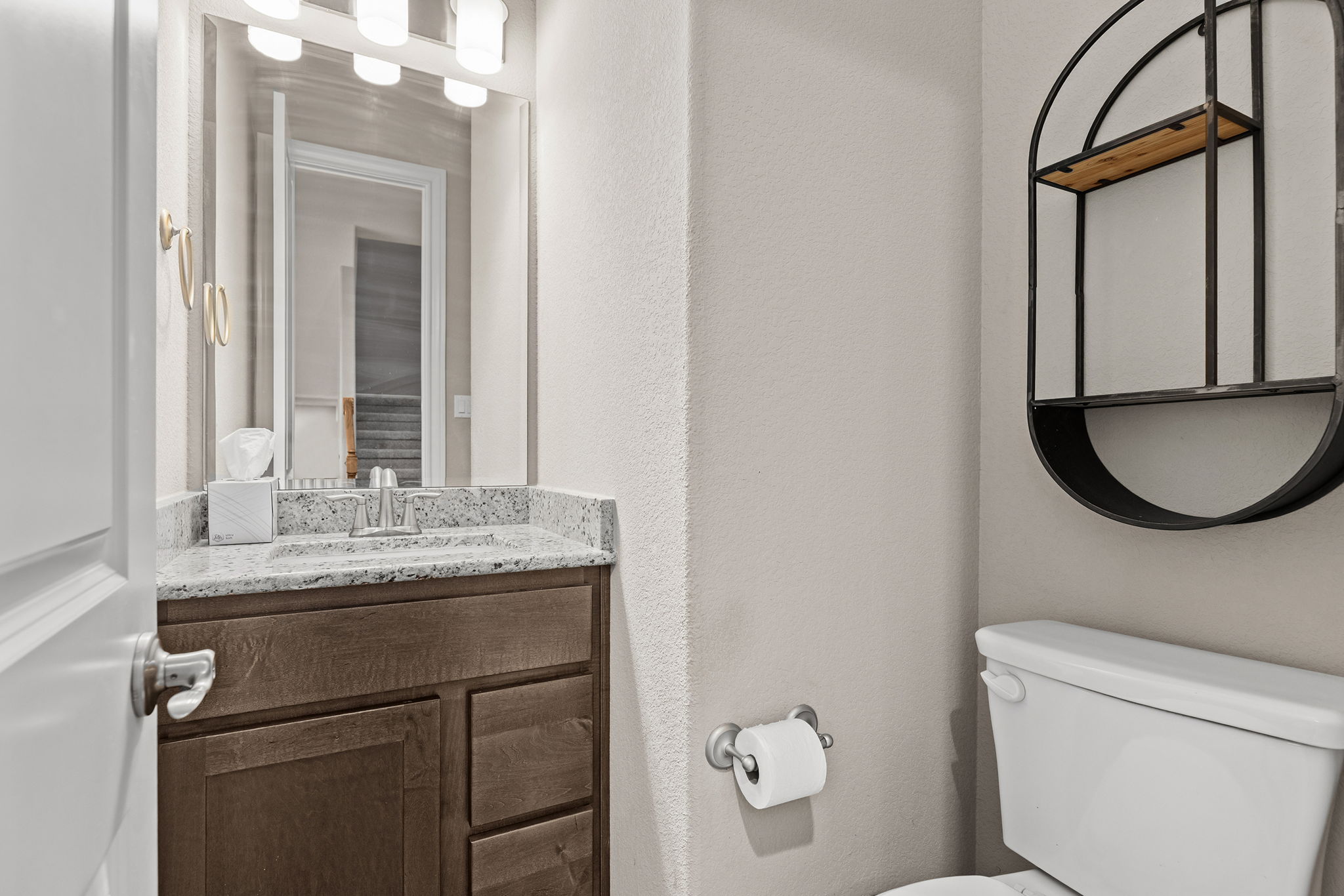 1125 Highknoll Lane Georgetown, TX 78628 - Photo 32 of 40 a bathroom with a granite countertop toilet sink and mirror