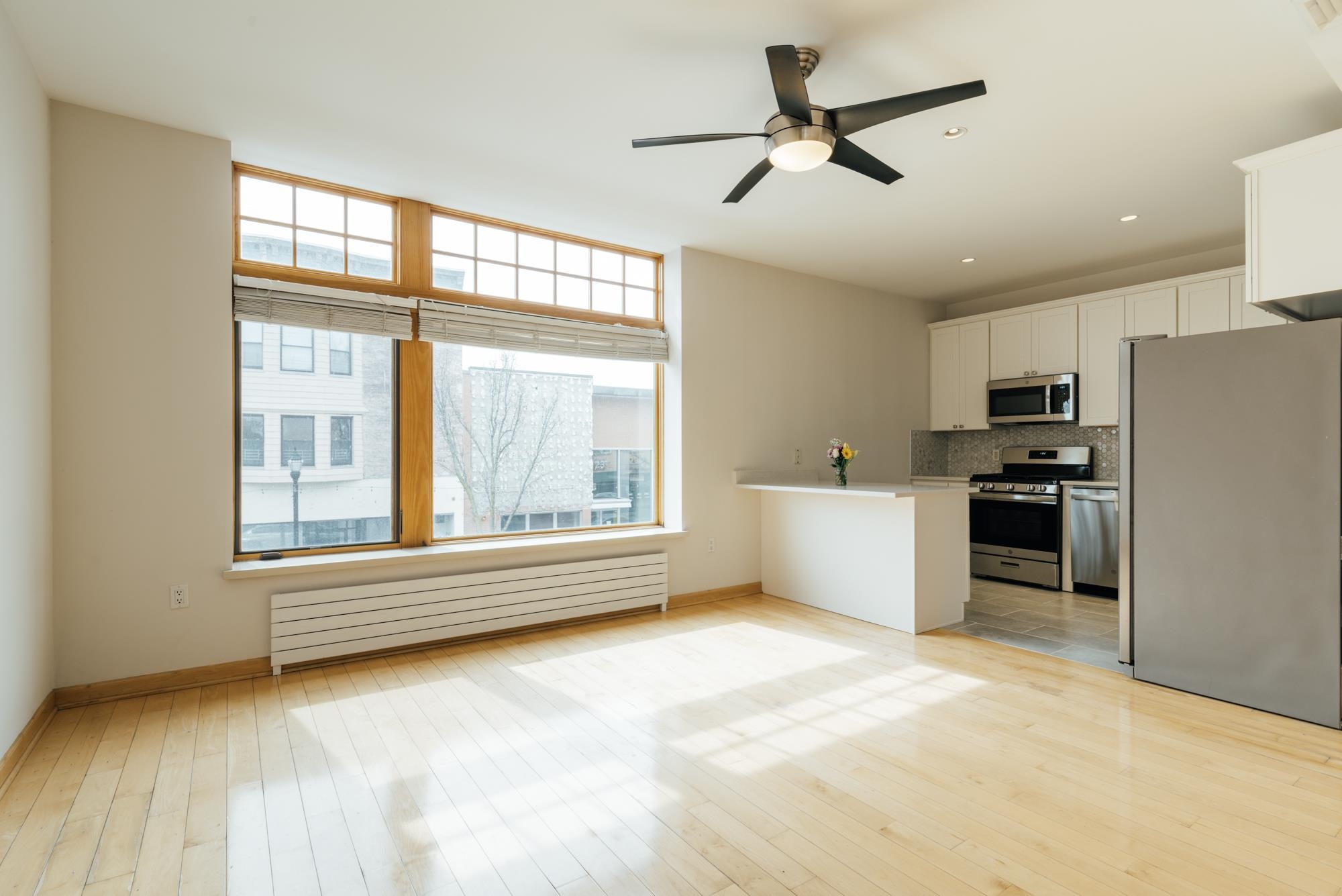 30 Park Avenue, Unit 2 Rutherford, NJ 07070 - Photo 15 of 34 a view of an empty room with a window and kitchen view