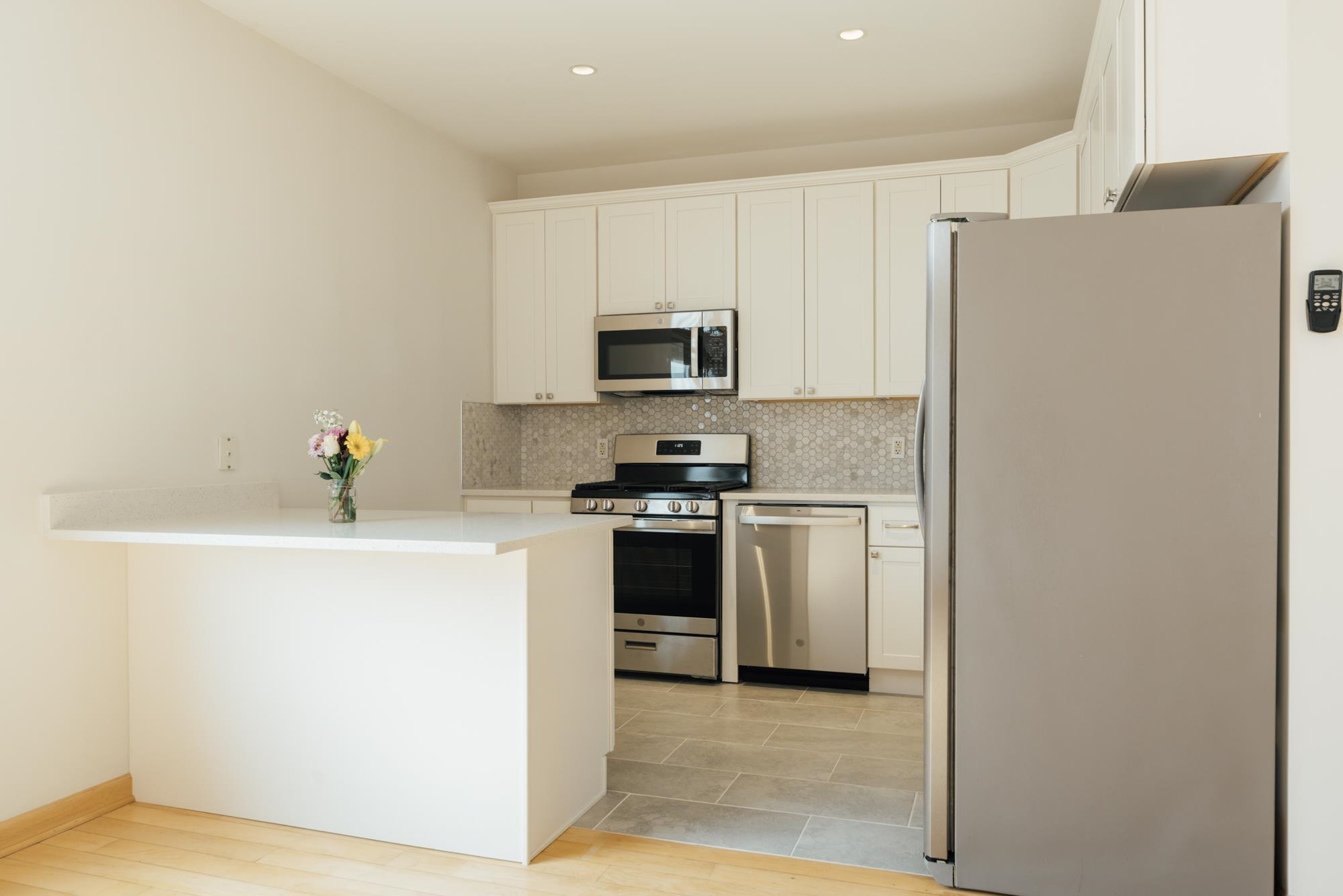 30 Park Avenue, Unit 2 Rutherford, NJ 07070 - Photo 17 of 34 a kitchen with a refrigerator stove and a sink