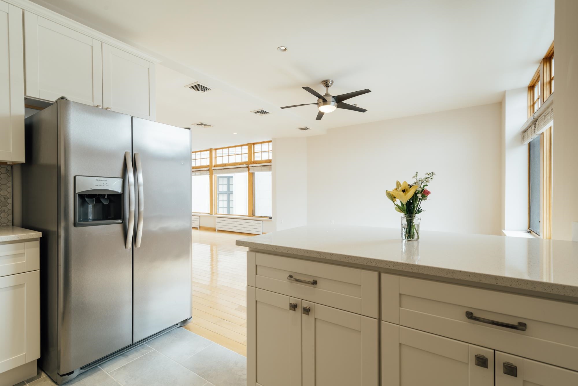 30 Park Avenue, Unit 2 Rutherford, NJ 07070 - Photo 19 of 34 a kitchen with stainless steel appliances granite countertop a refrigerator a sink and white cabinets