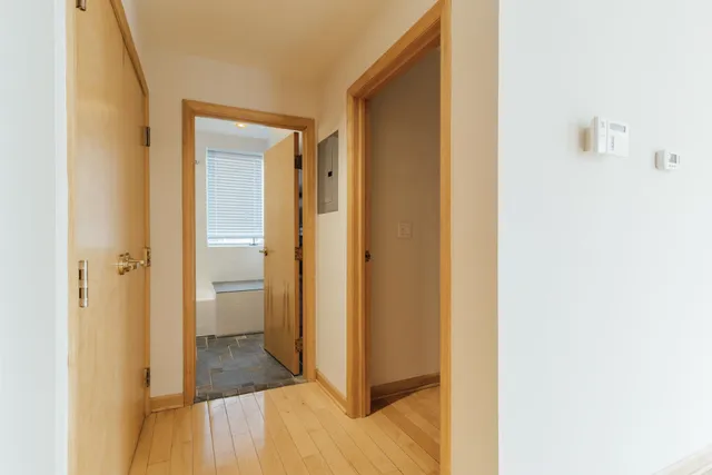 a view of a bathroom with a sink and a mirror