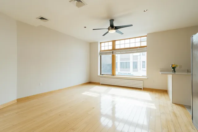 a view of an empty room with a window