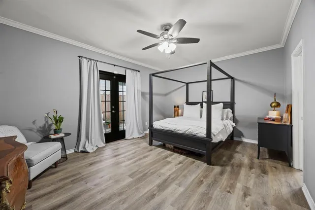 a bedroom with a bed and ceiling fan