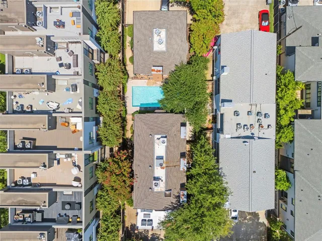 an aerial view of a house with outdoor space and street view