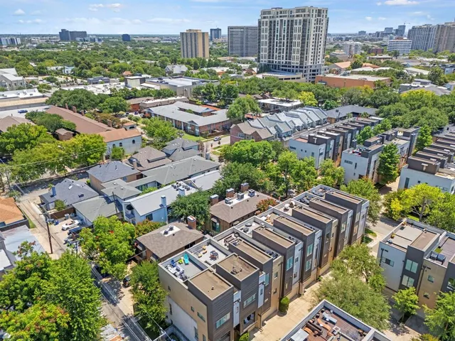 an aerial view of a city with lots of residential buildings