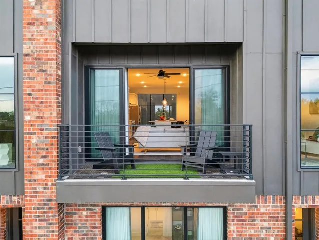 a view of a house with a small yard and wooden floor