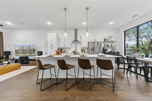 a kitchen with lots of counter space furniture and a view of living room