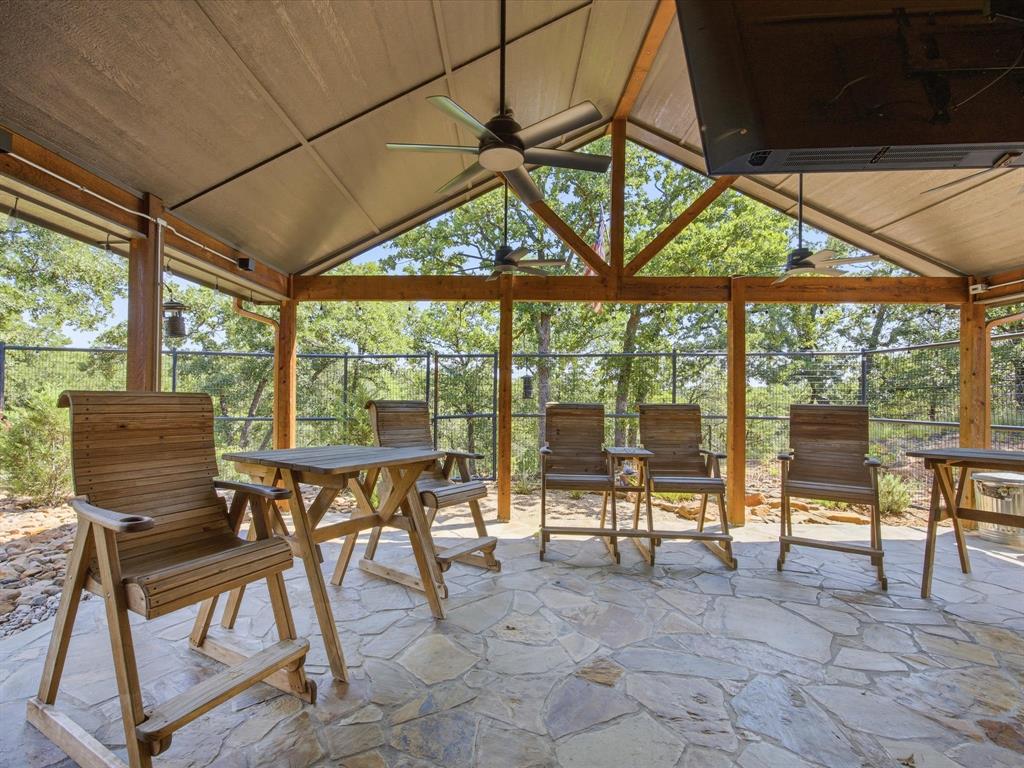117 Ranchview Court Bowie, TX 76230 - Photo 26 of 40 a view of a dining room with furniture large windows and wooden floor