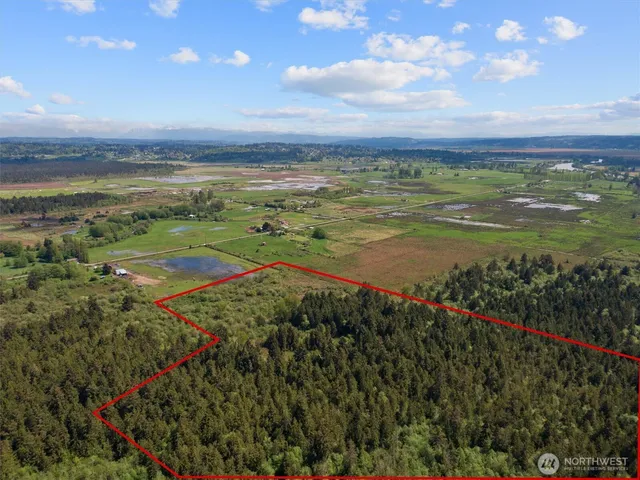 a view of an ocean and a mountain