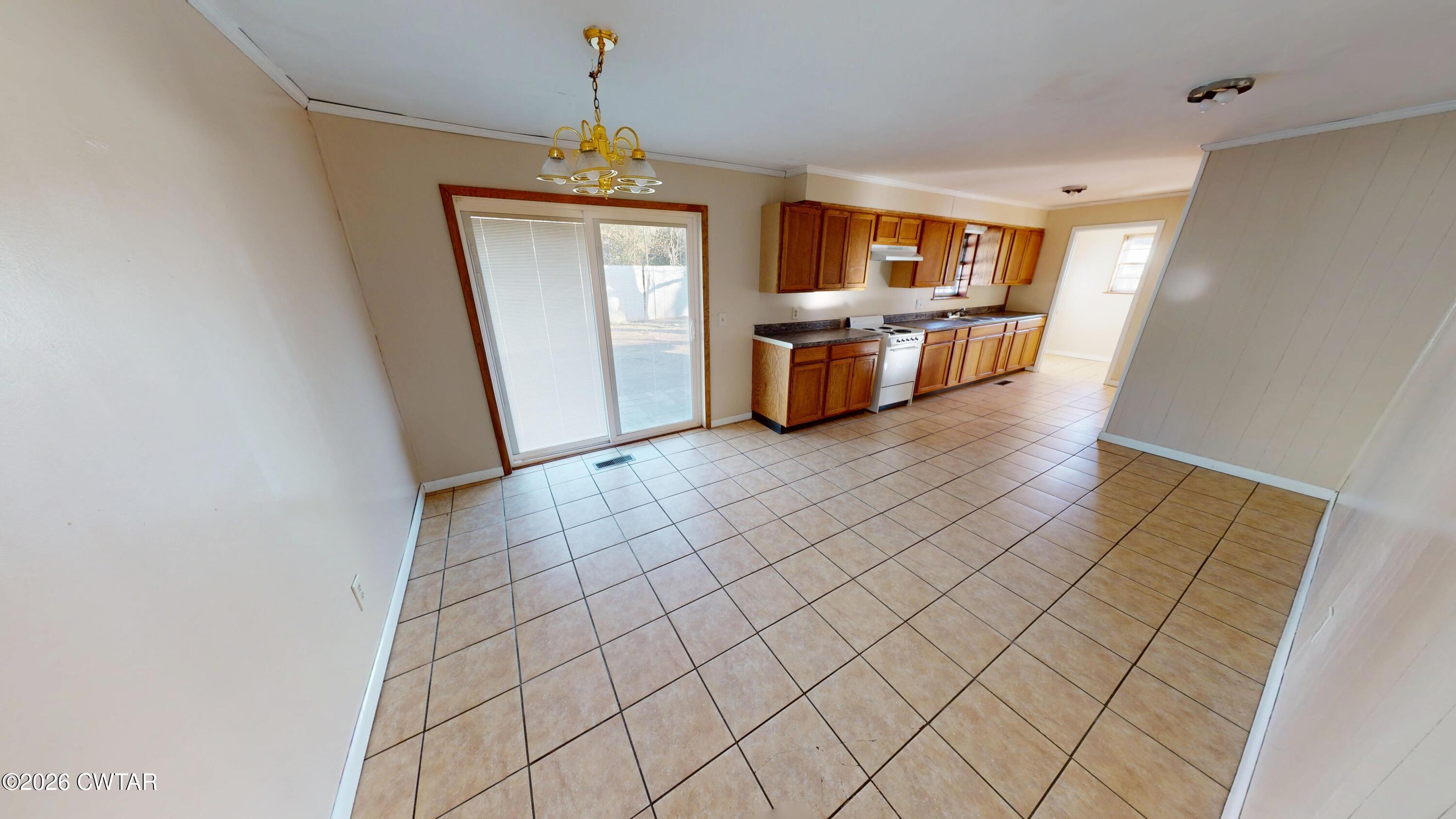 322 Jones Street Newbern, TN 38059 - Photo 12 of 22 a view of a kitchen with furniture and wooden floor