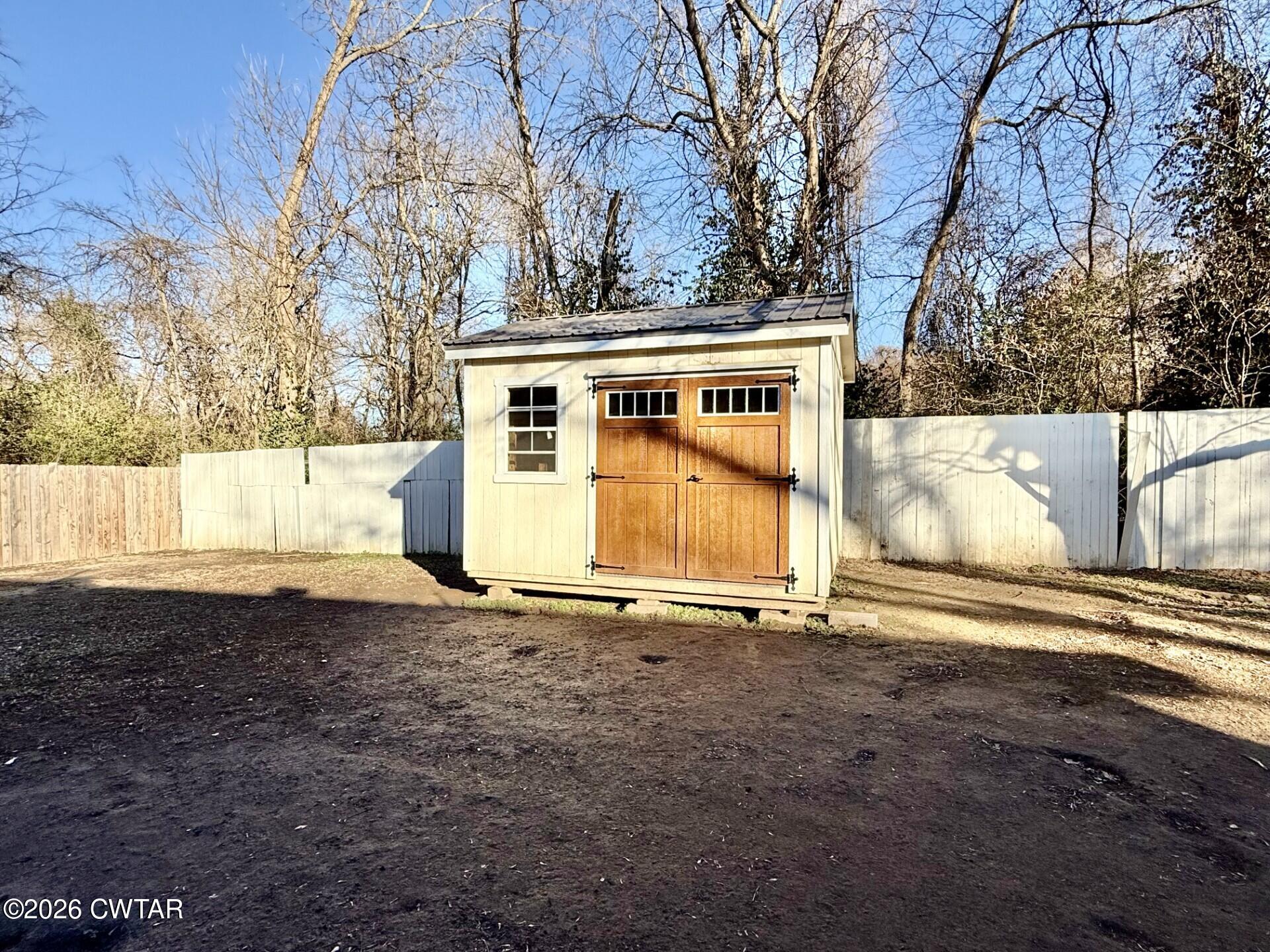 322 Jones Street Newbern, TN 38059 - Photo 22 of 22 a view of a house with a yard covered with snow in front of house