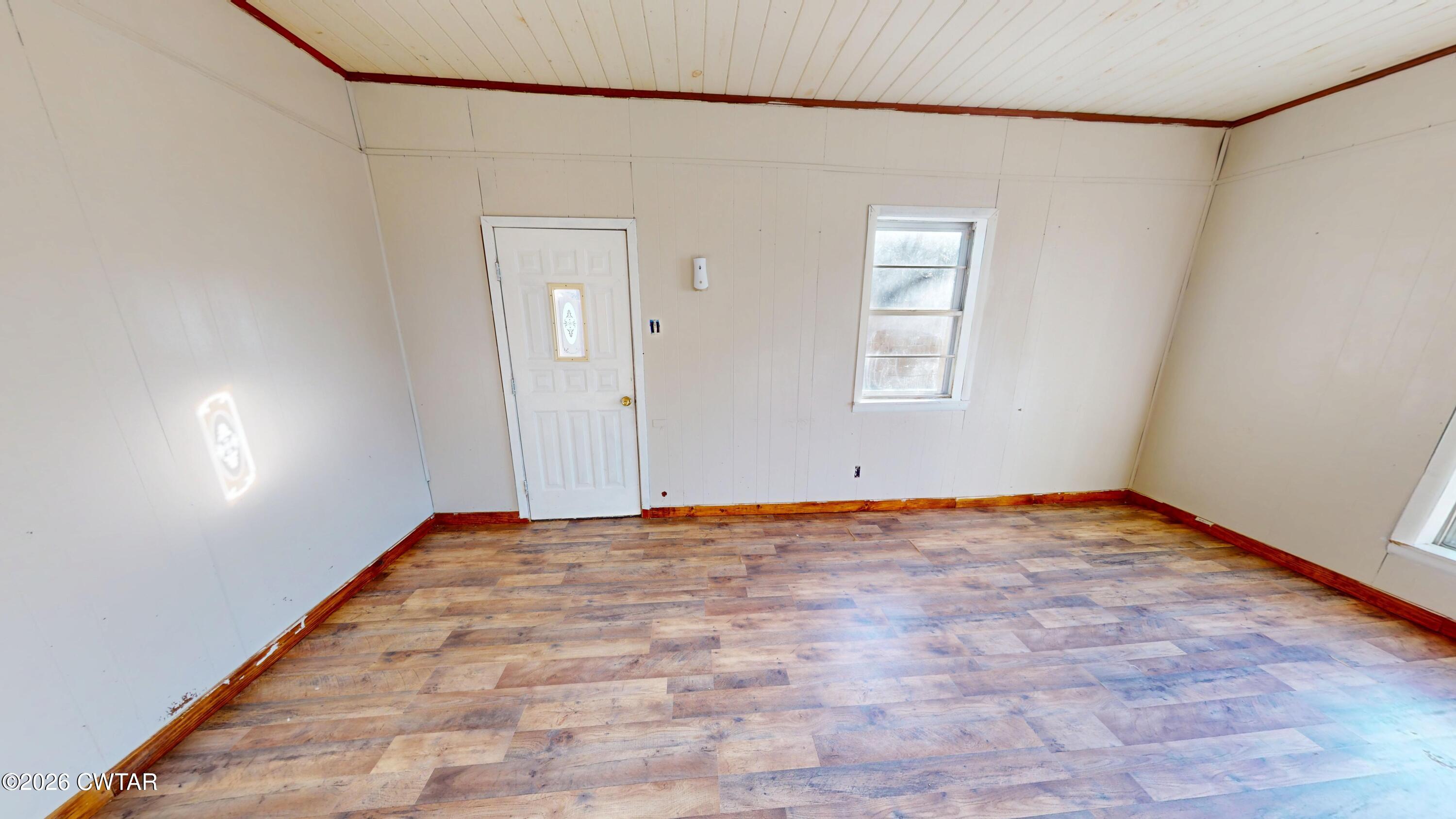322 Jones Street Newbern, TN 38059 - Photo 6 of 22 a view of an empty room with window and closet area