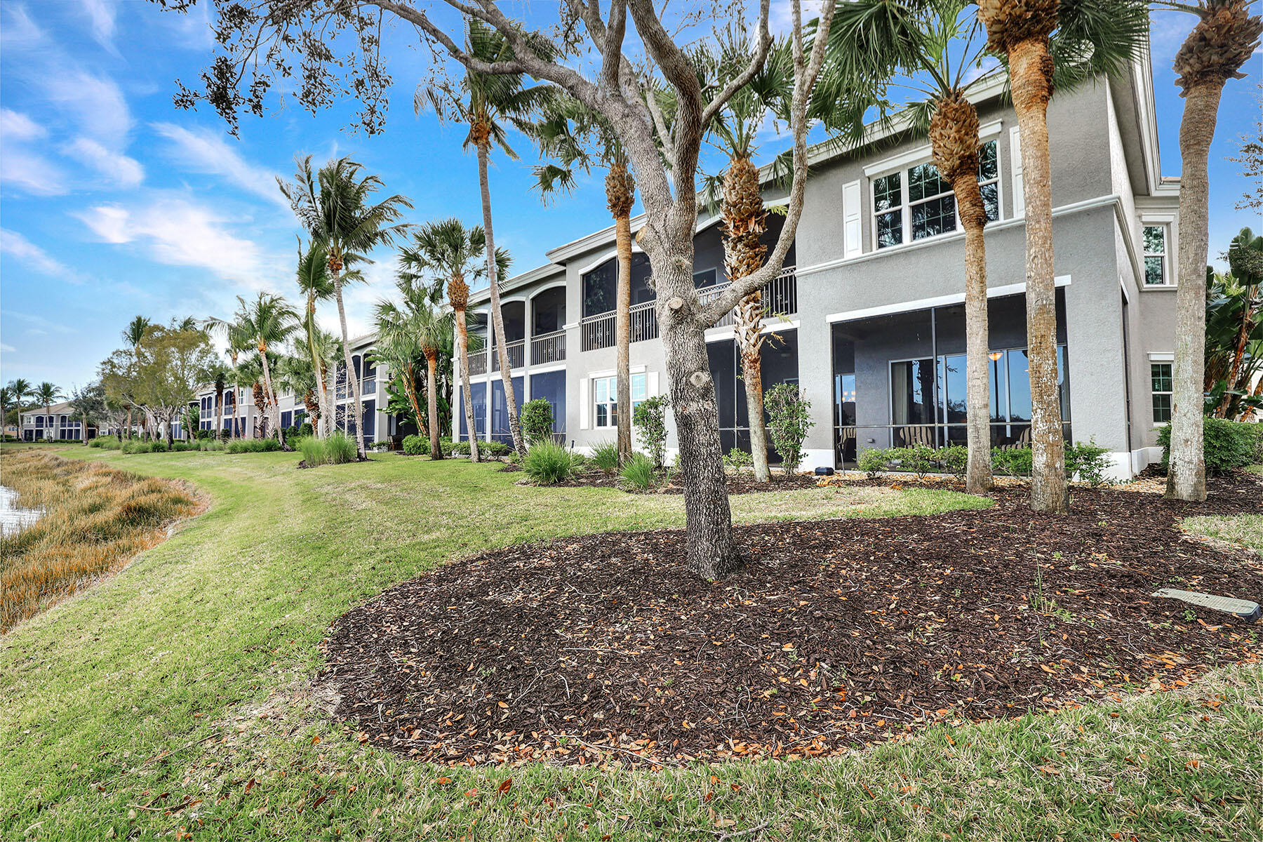 9234 Tesoro, Unit 101 Naples, FL 34114 - Photo 3 of 25 a view of a house with a yard