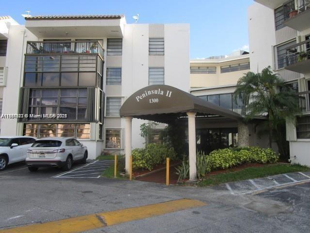 1300 Southwest 122nd Avenue, Unit 4072 Miami, FL 33184 - Photo 3 of 11 a view of a car park in front of house