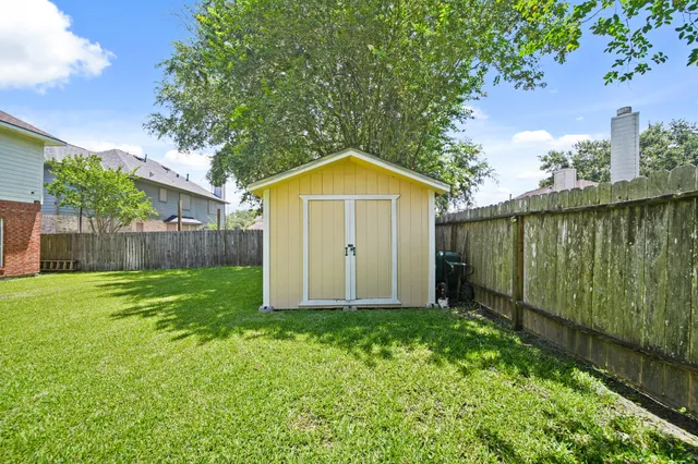 a view of a backyard with a garden and plants