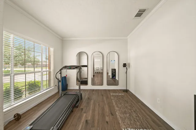a view of a balcony with wooden floor