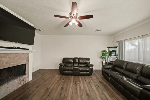a living room with furniture and a fireplace