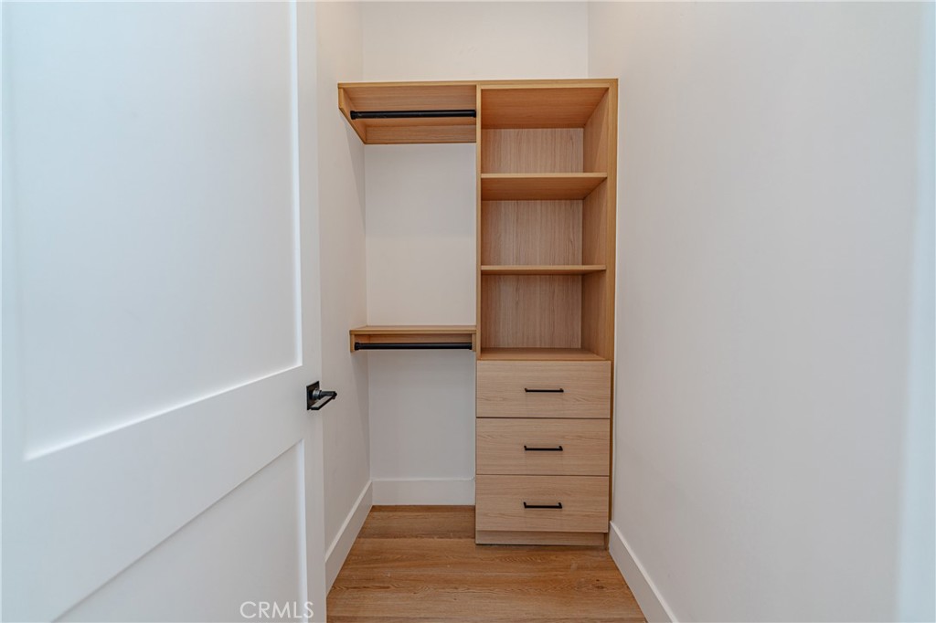 614 1/2 North Rampart Boulevard, Unit 1/2 Silver Lake, CA 90026 - Photo 15 of 41 a view of walk in closet with empty racks