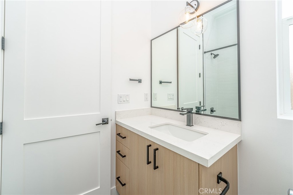 614 1/2 North Rampart Boulevard, Unit 1/2 Silver Lake, CA 90026 - Photo 21 of 41 a bathroom with a sink and a mirror