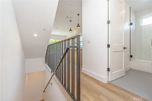 a view of a hallway with staircase