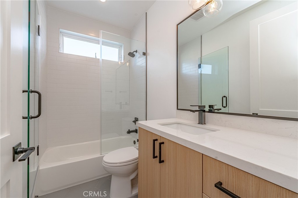 614 1/2 North Rampart Boulevard, Unit 1/2 Silver Lake, CA 90026 - Photo 24 of 41 a bathroom with a sink a toilet and shower
