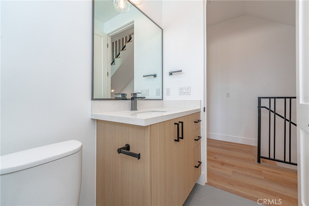 614 1/2 North Rampart Boulevard, Unit 1/2 Silver Lake, CA 90026 - Photo 26 of 41 a bathroom with a sink and a mirror