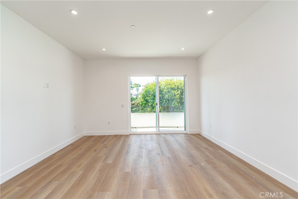 614 1/2 North Rampart Boulevard, Unit 1/2 Silver Lake, CA 90026 - Photo 30 of 41 a view of room with window and wooden floor