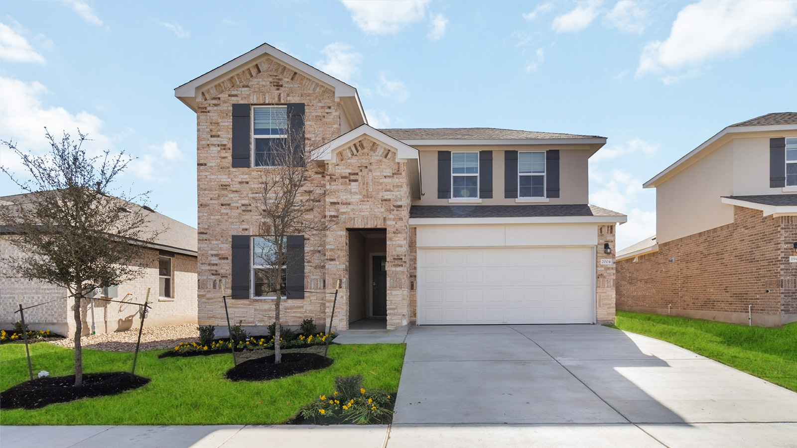 2560 Whittler Road Leander, TX 78641 - Photo 1 of 30 a front view of a house with a yard and a garage