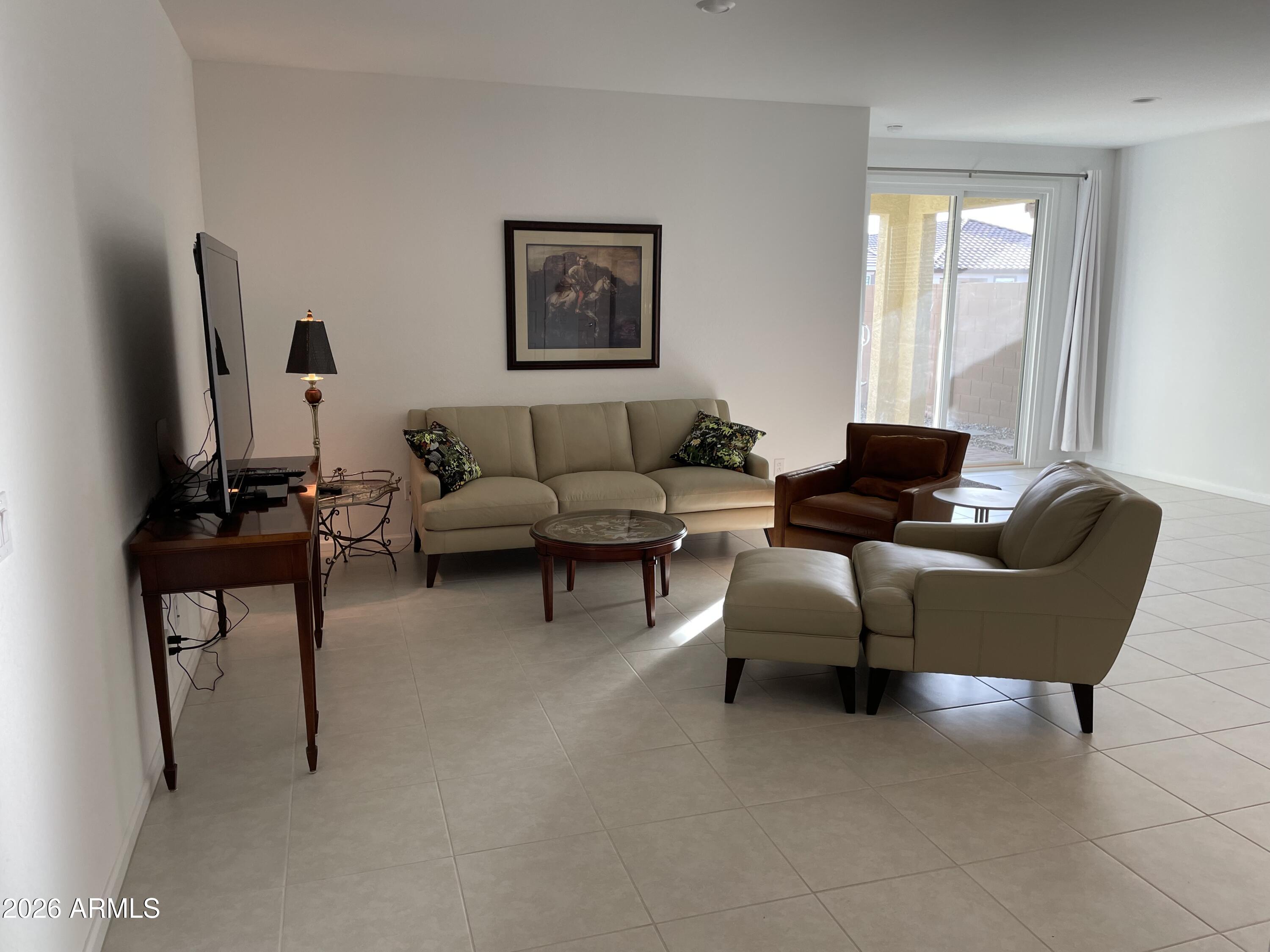 3009 East Riding Boot Way San Tan Valley, AZ 85140 - Photo 3 of 21 a living room with furniture and a window
