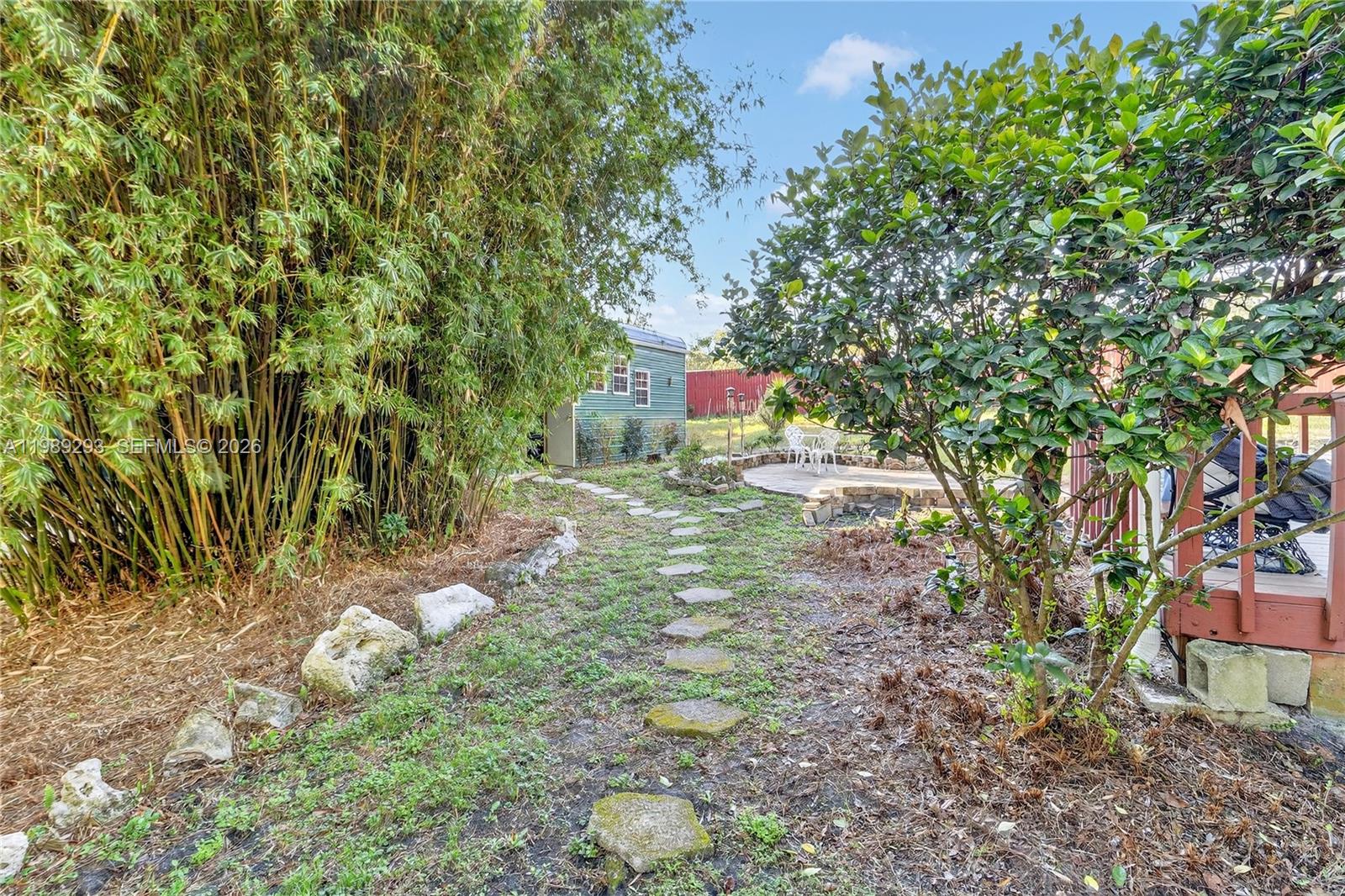 8435 Northwest 6 Avenue Gainesville, FL 32607 - Photo 13 of 52 Side yard with path leading to Workshop.
