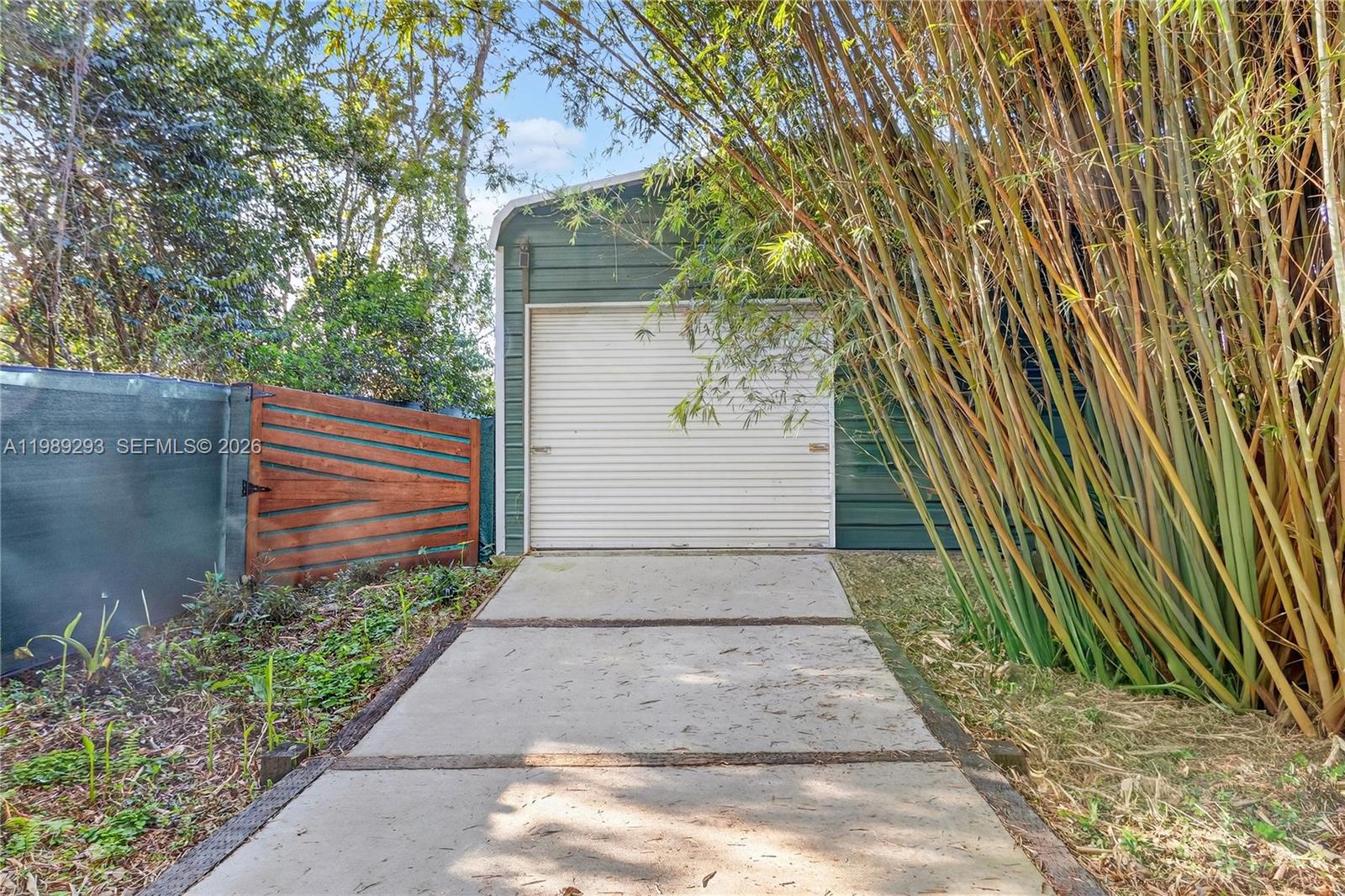 8435 Northwest 6 Avenue Gainesville, FL 32607 - Photo 15 of 52 Front side of Workshop with rolling metal door.