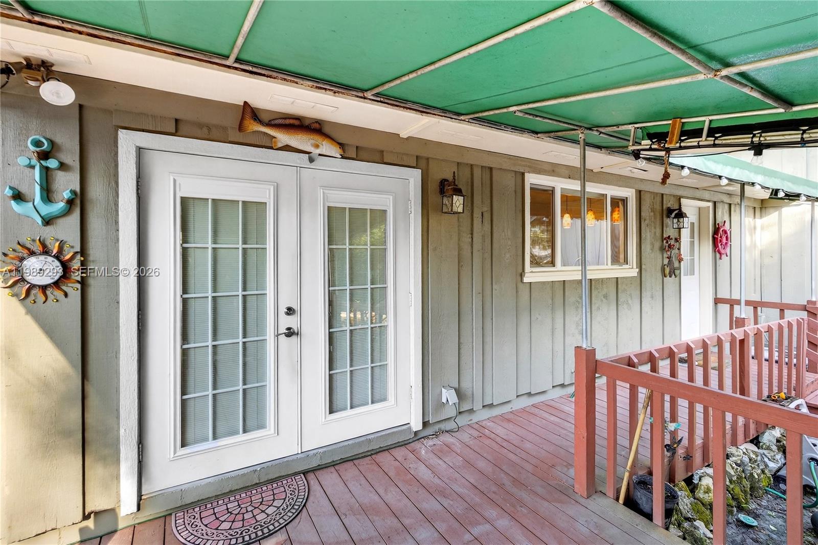 8435 Northwest 6 Avenue Gainesville, FL 32607 - Photo 19 of 52 Side covered deck off of Dining Room and side Kitchen door.