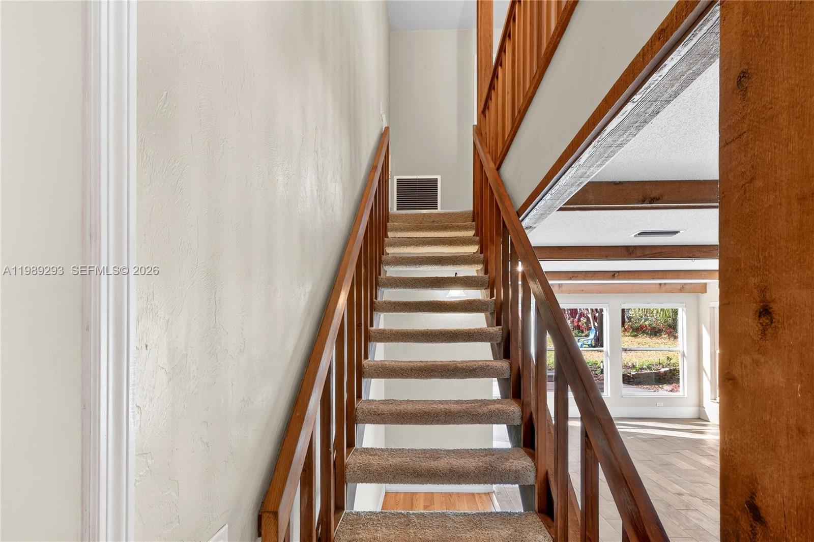 8435 Northwest 6 Avenue Gainesville, FL 32607 - Photo 41 of 52 Wood staircase to three upstairs bedrooms and bath.