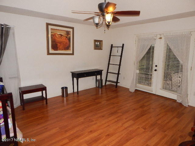 3133 Nautilus Road Middleburg, FL 32068 - Photo 11 of 17 a view of empty room with wooden floor and fan