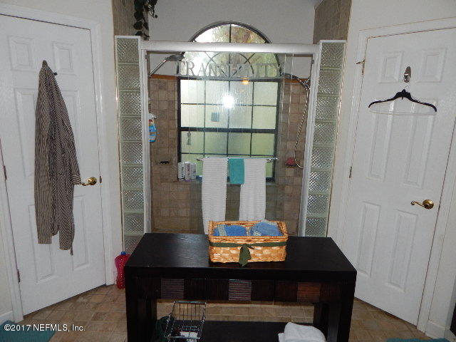3133 Nautilus Road Middleburg, FL 32068 - Photo 13 of 17 a view of a dining room with furniture and chandelier