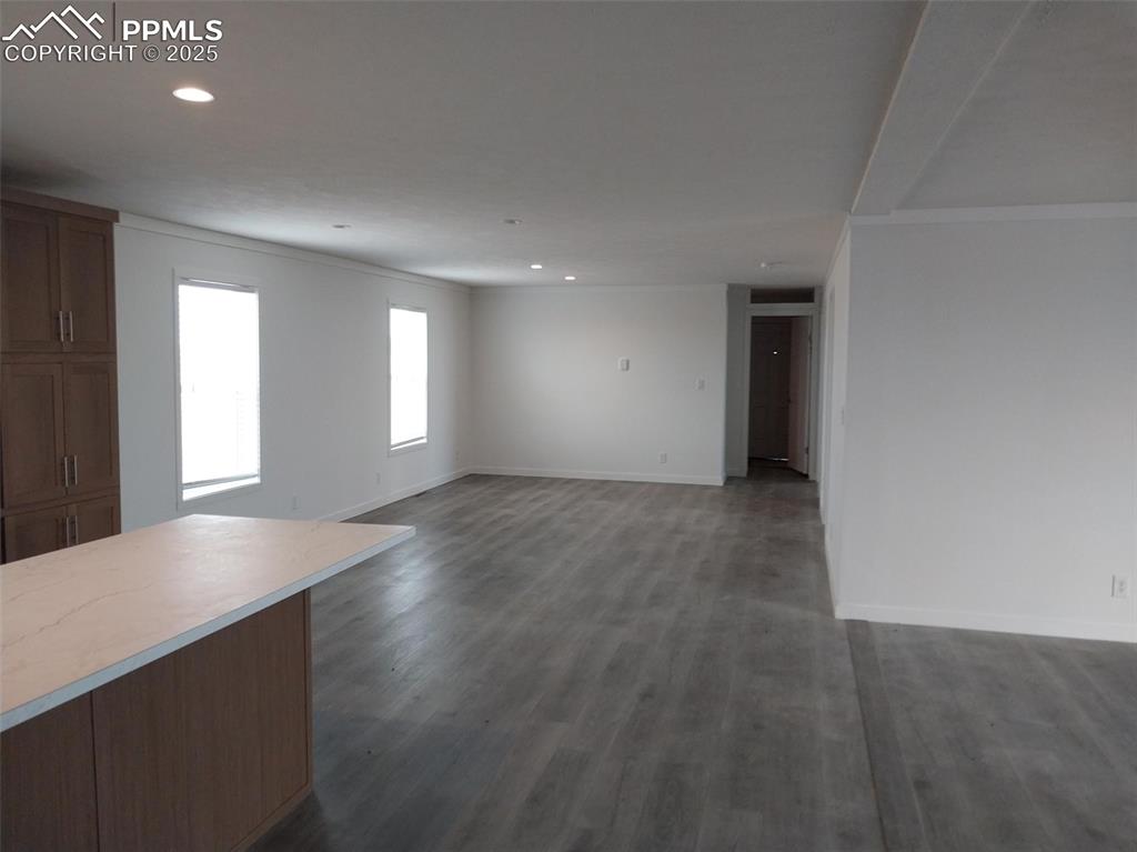 654 North Ramah Highway Yoder, CO 80864 - Photo 13 of 25 Unfurnished living room with dark wood finished floors and recessed lighting