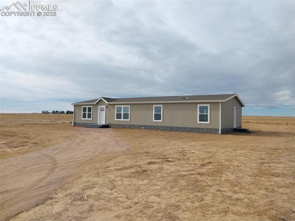 654 North Ramah Highway Yoder, CO 80864 - Photo 23 of 25 View of front of property featuring a shingled roof