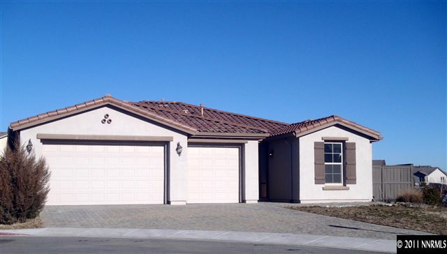 a front view of a house with a garage