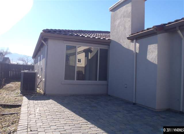 14045 Tagor Road Reno, NV 89521 - Photo 13 of 13 a view of a house with a wooden fence