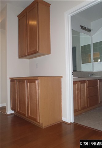 14045 Tagor Road Reno, NV 89521 - Photo 9 of 13 a view of a kitchen with wooden floor and cabinet