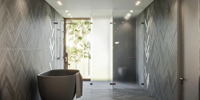 a bathroom with a granite countertop sink a toilet and shower