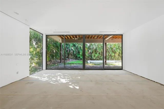 a view of a room with a large window