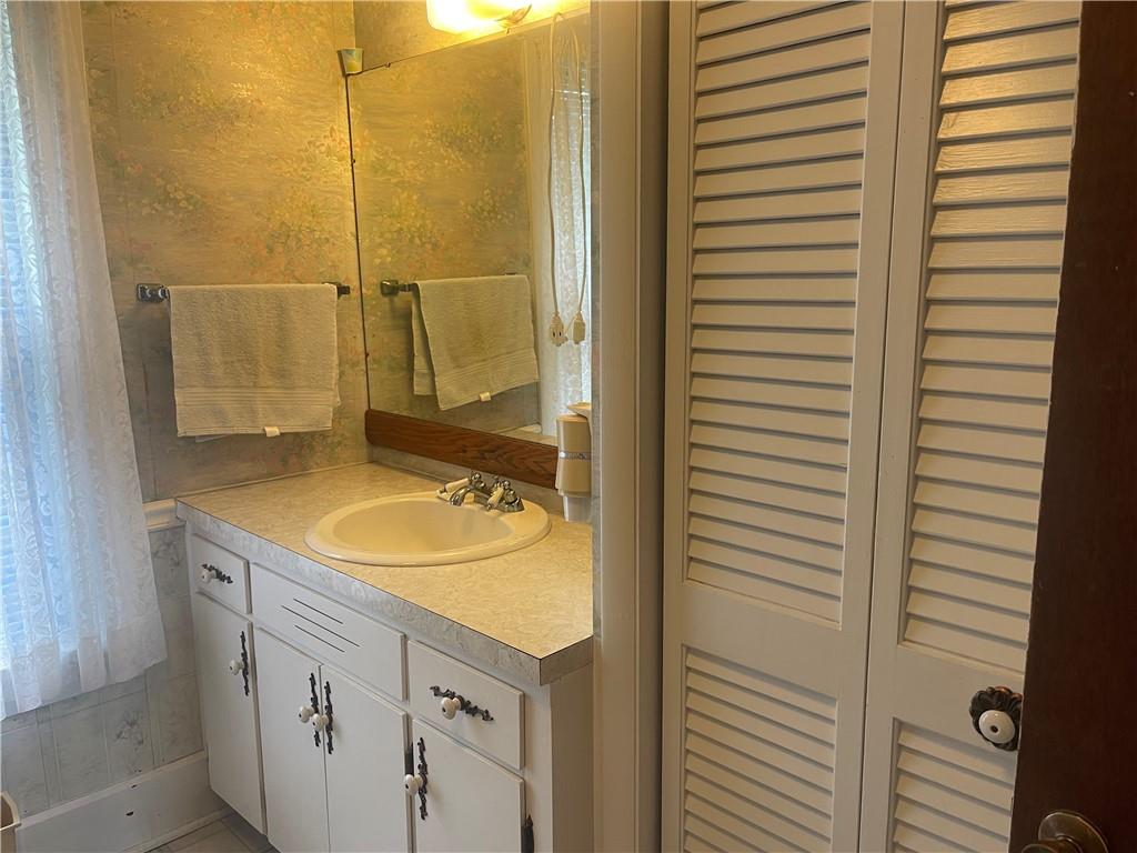 1055 East Lake Road Transfer, PA 16154 - Photo 24 of 27 a bathroom with a sink and a mirror