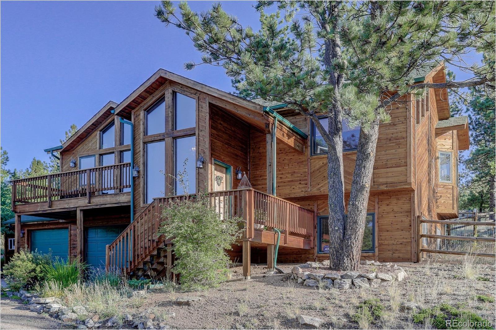 109 Royal Ridge Drive Bailey, CO 80421 - Photo 39 of 39 a view of a house with a yard and plants