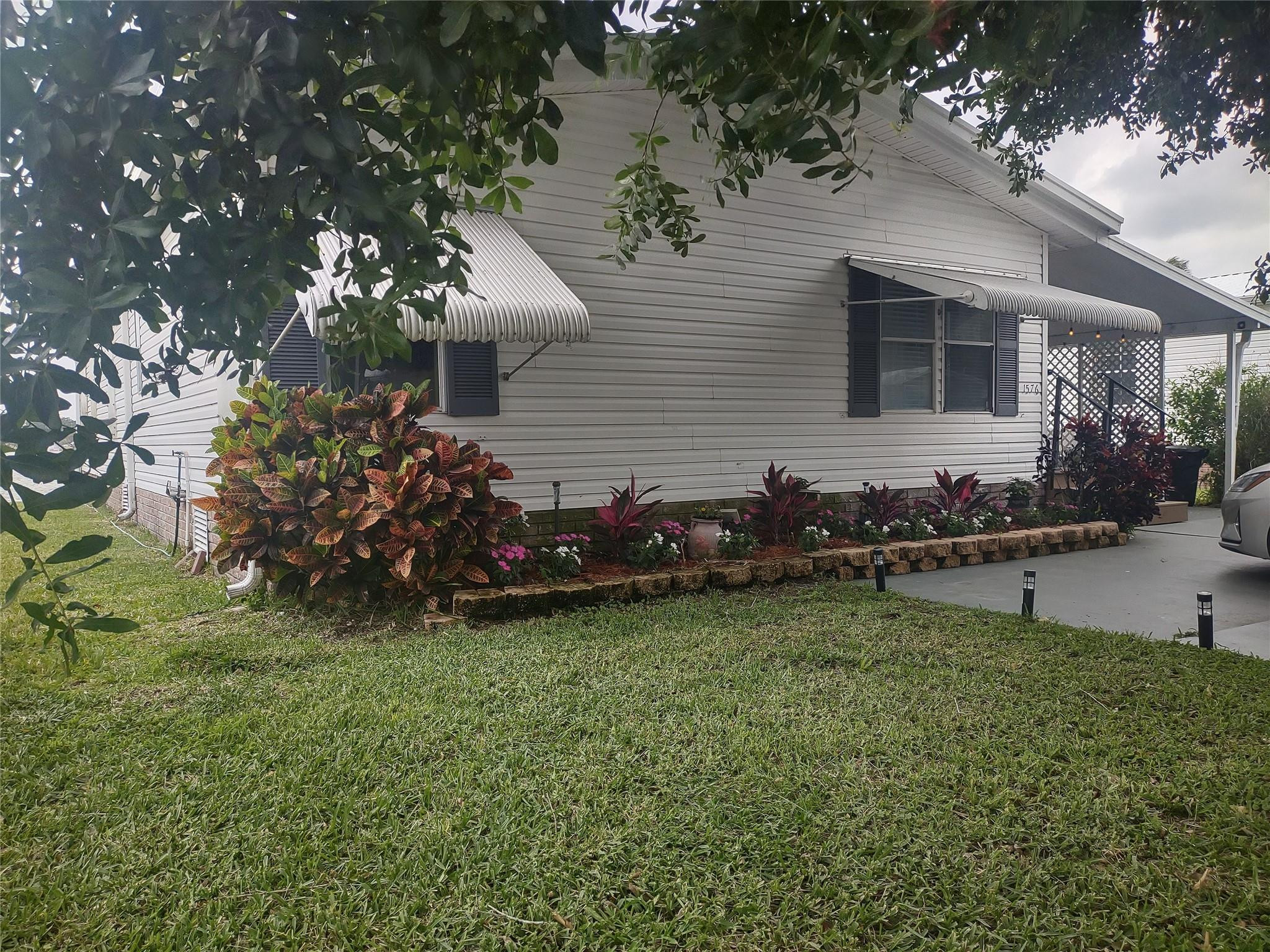 1576 Southwest 35th Circle Okeechobee, FL 34974 - Photo 3 of 42 a view of a backyard of the house
